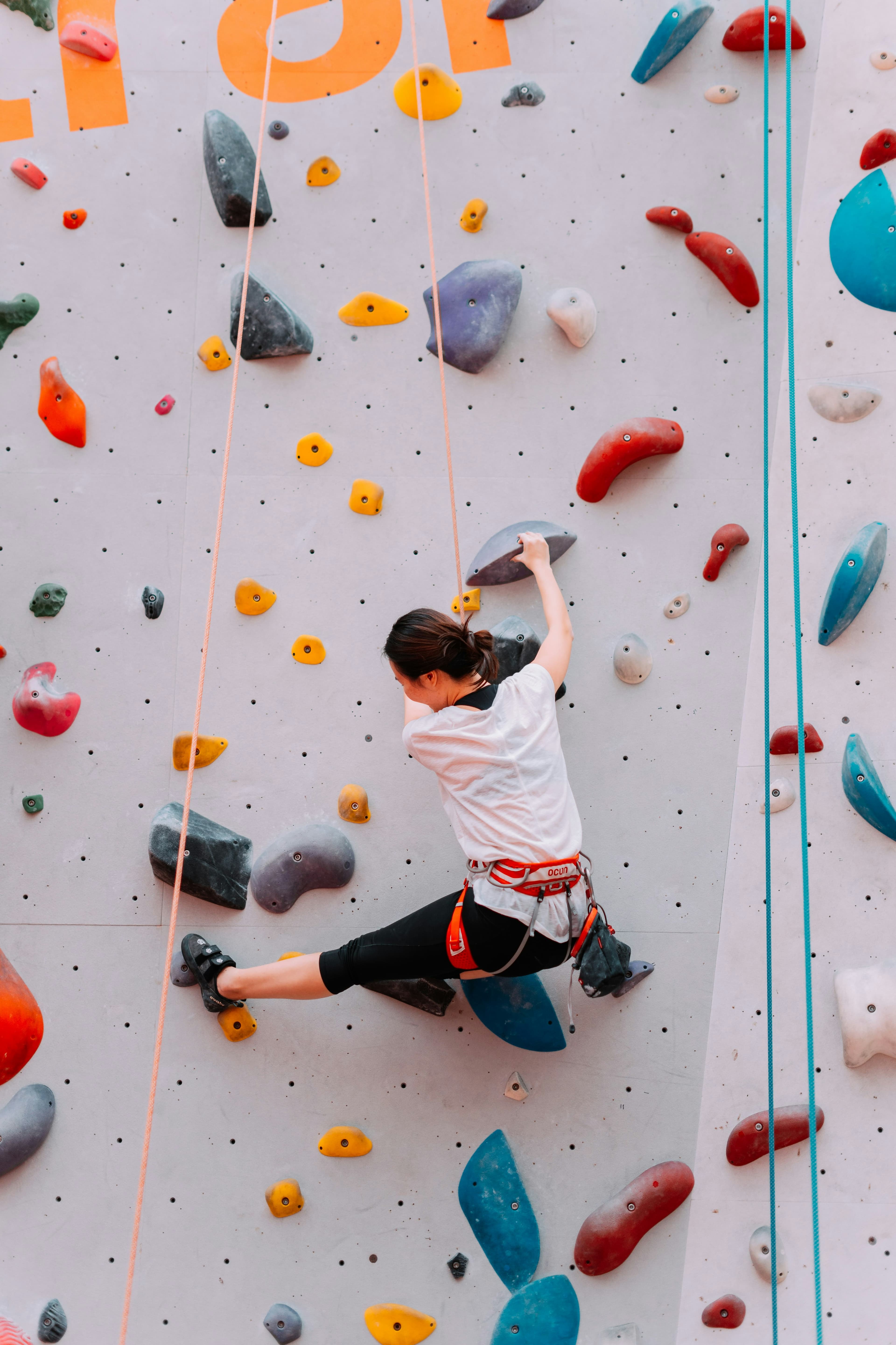 Climber on an indoor top-rope wall