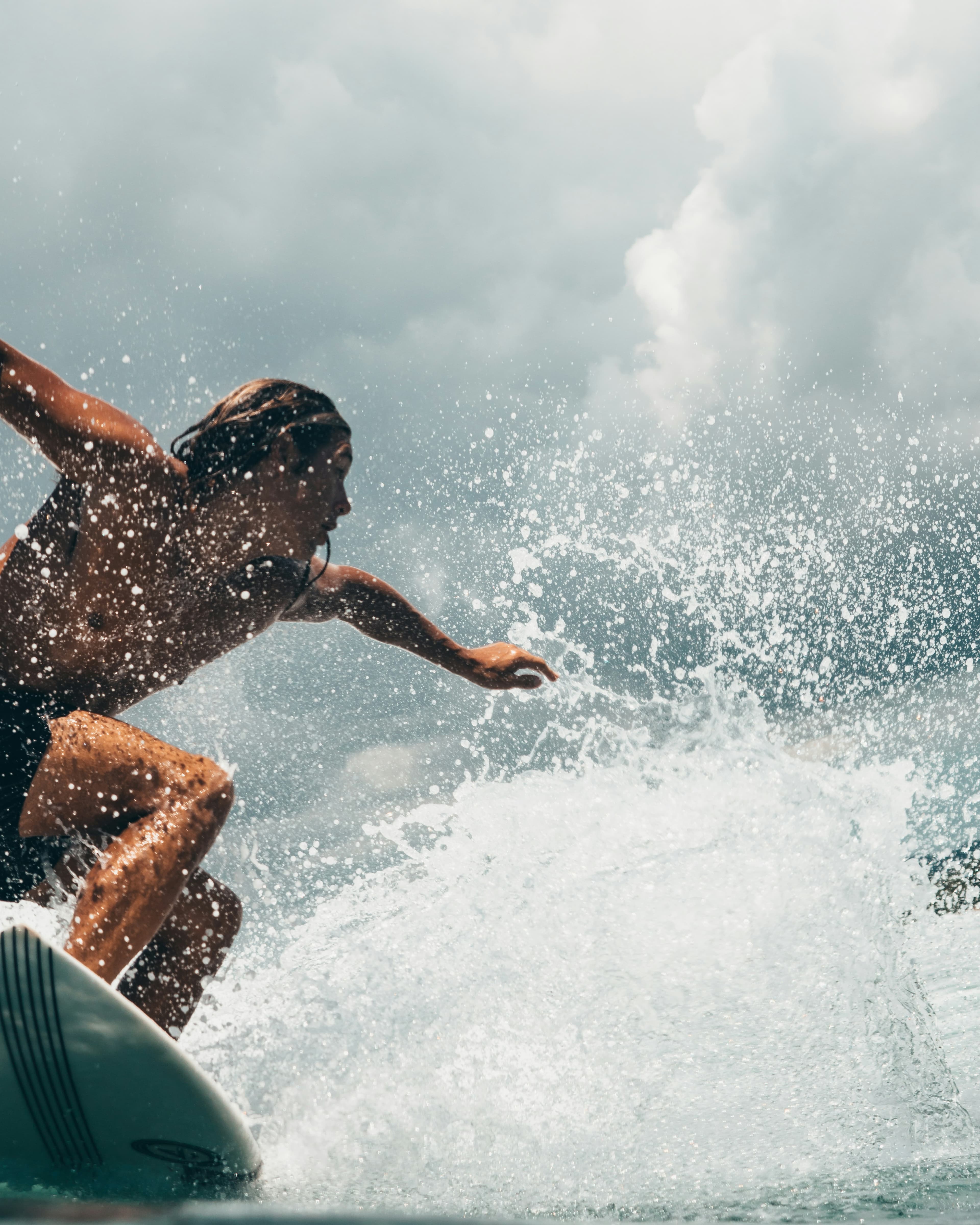 Surfer cutting through whitewater spray